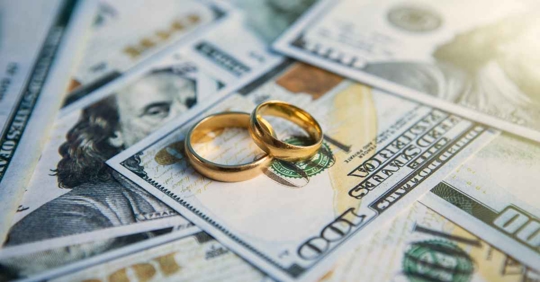 Wedding rings on money