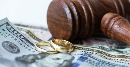 Money, wedding bands, and gavel