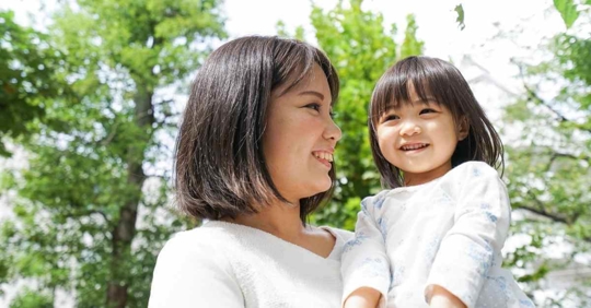 A woman holding her daughter
