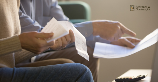 woman and man couple going over paperwork for child custody and child support parenting plan divorce