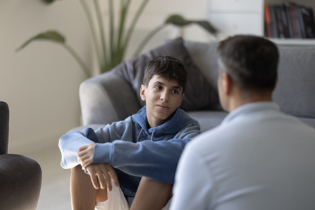 teen and father talking